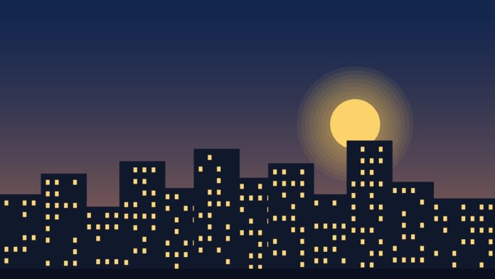 أفق مدينة أمريكية عند الغروب في إشارة إلى سوق العمل الأمريكي وبيانات طلبات إعانة البطالة